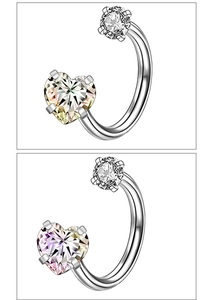 Detailed view of silver C-shape nose rings with heart-shaped pink and yellow zircons