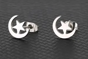 Detailed close-up of silver celestial moon and star titanium steel stud earrings