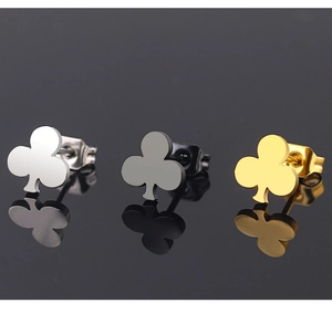 Three-leaf clover steel earrings shown in silver, black, and gold with a reflective finish