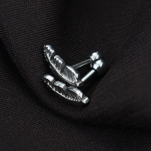 Silver geometric feather earrings in polished titanium steel with ball screw back design