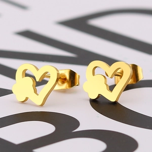 Golden heart-shaped titanium steel stud earrings with hollow flower pattern design