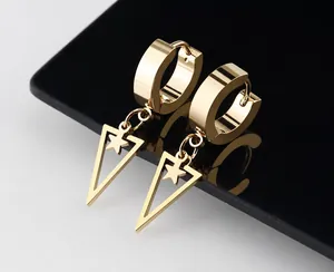 Detail of gold titanium steel hoop earrings with star-patterned hollow triangle pendants
