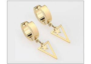 Detail of gold hoop earrings with star-nested triangle charms for a minimalist hip hop look