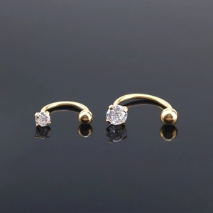 G23 titanium curved barbell with sparkling zircon and gold finish for eyebrow and ear piercings