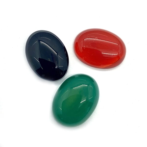 Polished oval cabochon gemstones in black, green and orange carnelian for DIY jewelry