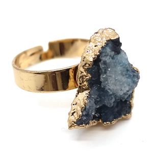 Macro detail of natural blue crystal cluster ring with adjustable gold metal band