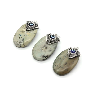 Oval turquoise stone pendant with evil eye charm and sparkling crystals for DIY necklaces