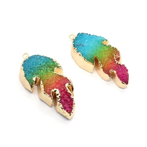 Rainbow crystal leaf pendants with golden plated edges and vibrant gradient colors