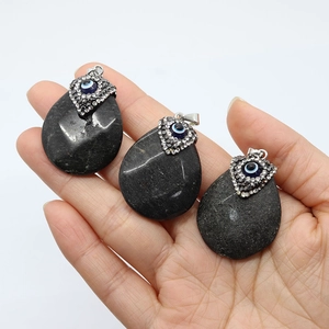 Three teardrop black agate pendants with evil eye inlay and silver bails for jewelry