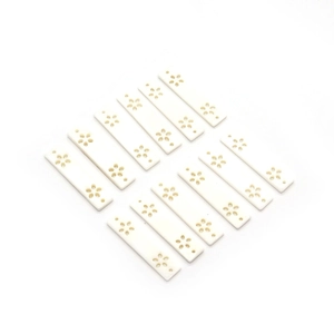 Set of 12 rectangular white natural shell pendants with hollowed flower carvings