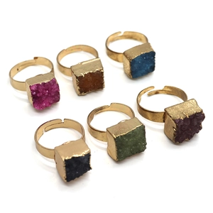 Set of six adjustable gold-plated rings featuring natural raw crystal clusters in multi-colors