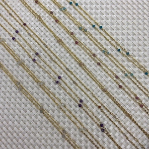 Multiple rows of colorful gemstone beads on gold plated copper cable chains for DIY jewelry
