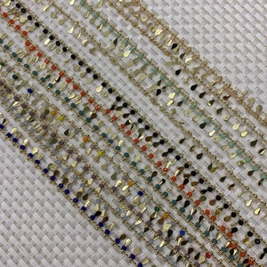 Golden chain jewelry with teardrop charms and colorful beads for DIY bracelets and necklaces