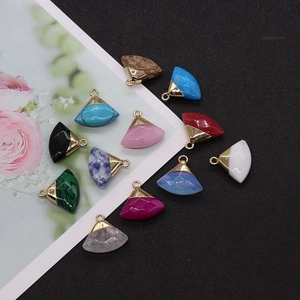 Detailed view of colorful fan-shaped natural stone pendants with gold metal plated bails