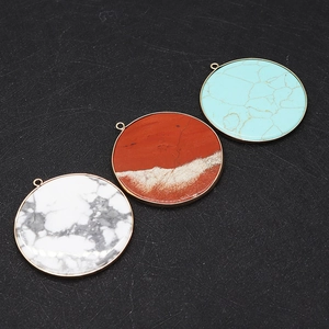 Close-up of 50mm natural stone round pendants with gold trim for DIY jewelry making