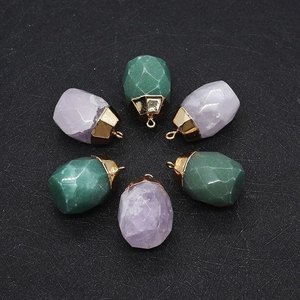 Faceted natural stone pendants in green and purple with golden metal bails for jewelry