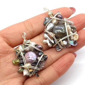 Handmade large baroque pearl pendants with wire-wrapped shells and metal accents