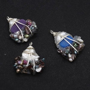 Detailed wire-wrapped heart pendants with natural pearls and colorful raw gemstones