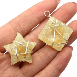 Handmade yellow crystal pendants in star and square shapes with silver wire wrap