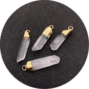 Natural white crystal quartz pendants with gold-plated caps and hexagonal prism shapes