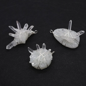 Three handmade wire wrapped natural clear crystal cluster pendants with silver loops