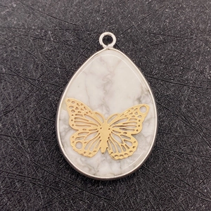 Water drop natural white stone pendant with gold hollow butterfly inlay and silver bail