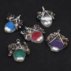 Detailed wire-wrapped crystal pendants with freshwater pearls and assorted stone clusters