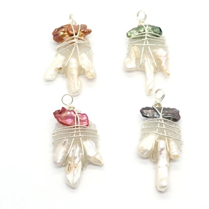 Baroque pearl and crystal wire wrapped pendants in four colors on white background