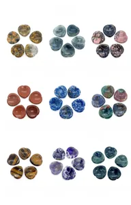 Collection of nine heart-shaped natural stone worry stones with ergonomic thumb groove