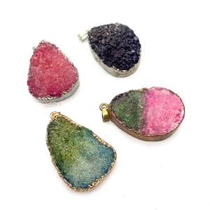 Set of four colorful irregular druzy quartz pendants with gold and silver plated metal edges