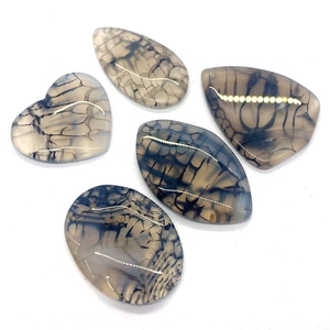 Five assorted dragon vein agate pendants in heart and water drop shapes with natural veins
