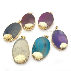 Set of six oval agate stone pendants with gold plating and small shell charm ornaments