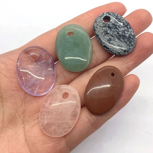 Handheld set of five oval natural semi-precious stone pendants with polished finish