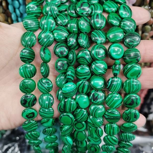 Detailed close-up of natural green malachite flat coin beads with unique striped textures