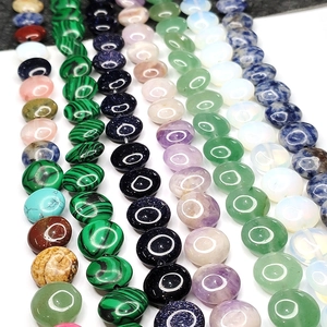 Various natural gemstone disk beads including malachite and amethyst for DIY jewelry making