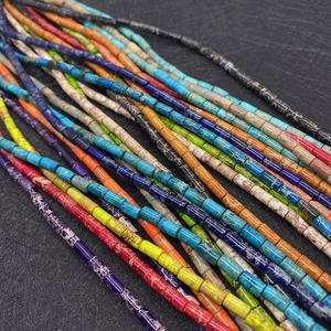 Macro shot of colorful imperial jasper cylinder beads showing natural marble textures
