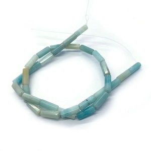 Macro detail of natural amazonite tube beads with blue and green mineral textures