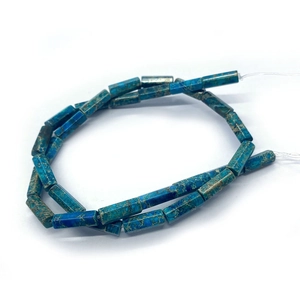 Macro detail of natural imperial jasper cylinder beads with unique turquoise blue texture