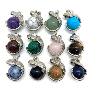 Natural gemstone sphere pendants with silver lizard wrap frame in twelve varied crystal types