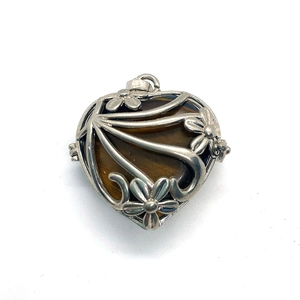 Silver hollow flower heart locket pendant featuring natural tiger eye stone inlay