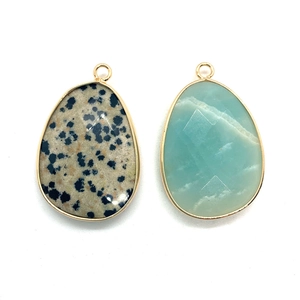 Natural teardrop stone pendants with gold metal edge in blue and green colors