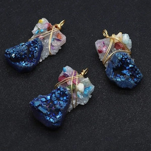 Macro detail of natural blue druzy stone pendants with colorful crushed stones and gold wire wrapping