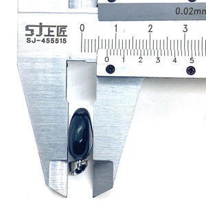 Measuring the black onyx oval gemstone pendant with a digital caliper for exact size
