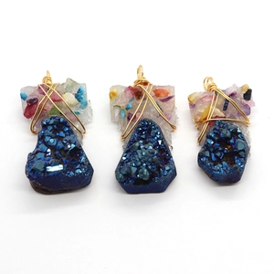 Three pieces of wire-wrapped natural blue crystal stone pendants with golden wire