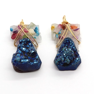 Natural blue crystal stone pendant with gold wire wrap and colorful resin detail