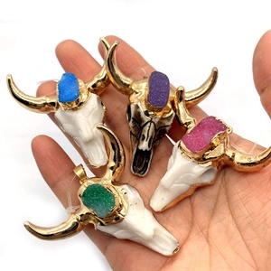Set of four ox head pendants with gold plating and colorful stones for DIY jewelry