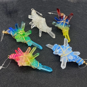 Detailed macro view of handmade wire wrapped raw crystal cluster pendants in various colors
