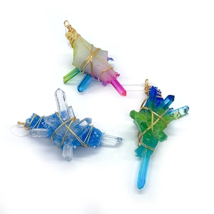 Three handmade wire wrapped crystal point pendants in colorful gradient stones and gold wire
