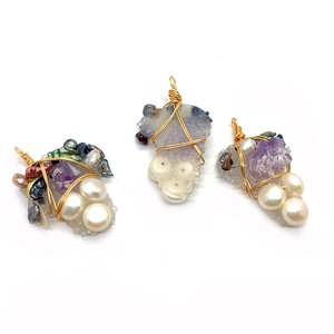Handmade wire-wrapped natural amethyst and pearl grape pendants with gold metal detailing