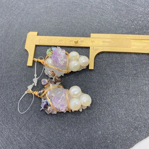 Handmade grape-shaped earrings with purple crystals and pearls measured by caliper